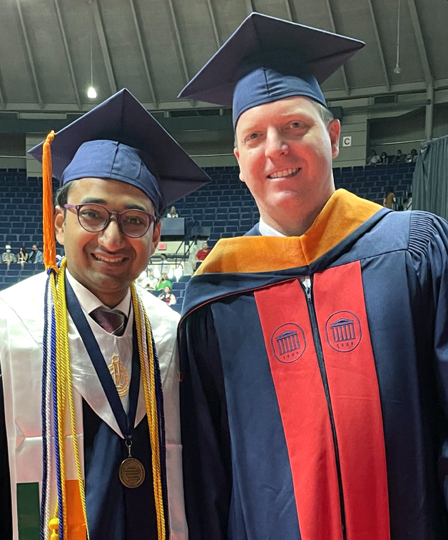 Male international student smiles during his undergraduate graduation ceremony